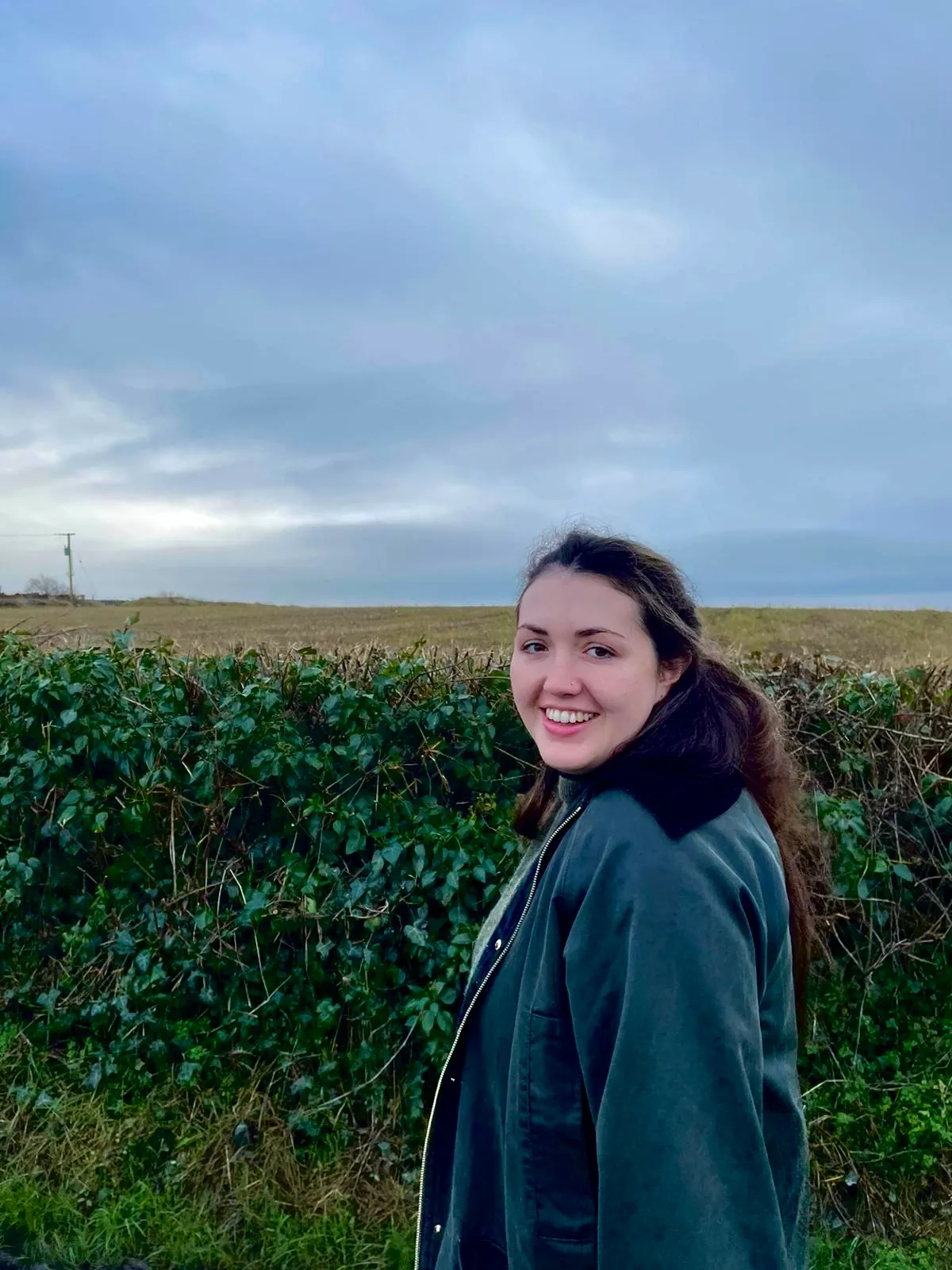 Erin Tierney walking through a field